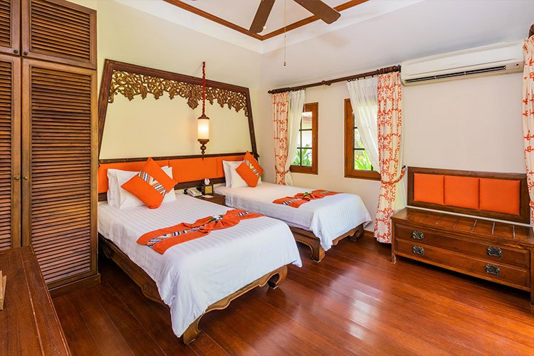 Anavana Beach Resort Deluxe Cottage with Twin Beds and Orange Highlights
